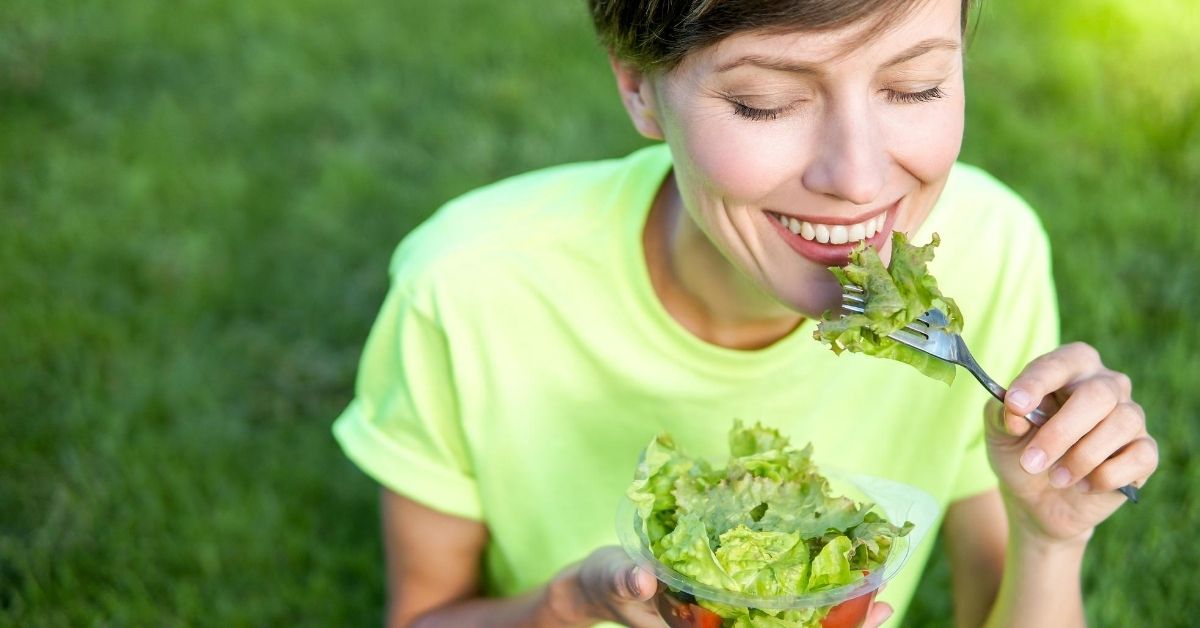Woman eating greens